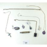 Eight various silver pendants and chains