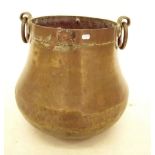 An Eastern brass cauldron with drop handles, 33cm tall