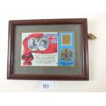 A framed 1911 Coronation souvenir postcard