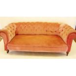 A Victorian pink upholstered Chesterfield settee,