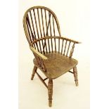 An early 20th century elm seated Windsor chair