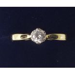 An 18 ct gold solitaire diamond ring - size N 1/2.