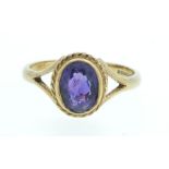 A 9ct gold ring set with amethyst - size N 1/2 to O.