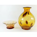 A mid 20th century Thomas Webb amber glass dimpled bowl, 23cm, signed and a large amber glass