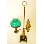 A Victorian brass adjustable oil lamp with green glass shade, 59cm