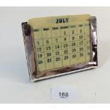 A silver framed desk calendar with ivory date panels, 12cm wide - Chester 1913