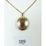 A 9 carat gold locket on a 9 carat gold chain - 8 gram total