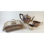 A silver plated entree dish and an electro plated Brittania metal three piece tea set