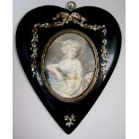 A late 18th century/early 19th century French water colour on ivory miniature portrait of a