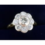 An 18 ct gold diamond set cluster ring, Size I/J