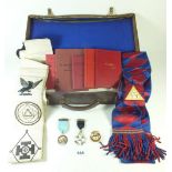 A case of Masonic Regalia including one silver gilt jewel, various other jewels, sashes and books