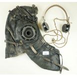 A circa WWII leather flying helmet together with vintage S.G Brown Type F headphones