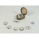 A collection of silver items including six rings, pocket watch case and T-bar, 58.6g