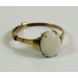 A 9ct gold and opal ring - size Q.
