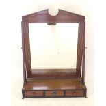 A fine Edwardian mahogany large toiletry mirror on a box base with crossbanding and three drawers.