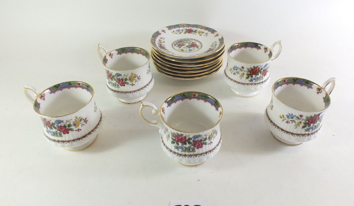 A Queens 'Flowers of Amaran' set of five cups and seven saucers