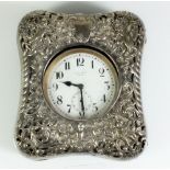 A large pocket watch in a pierced silver watch holder case, watch marked for Ruddy Bros, Truro,