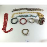 A box of Eastern (Indian and Chinese) jewellery and bangles, necklaces, bracelets etc
