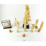 A collection of faux ivory figurines