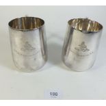 A pair of mid 20thC Elkington and Co. silver plated tankards engraved with Royal Artillery emblems