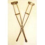 A pair of WWI vintage wooden 'Wantage Adjustable' crutches - patented by Dr William Dunsmore