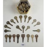 A box of various old Yale keys.