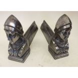 A pair of silvered Joan of Arc fire dogs