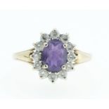 A 9ct gold amethyst and white stone ring - size P.