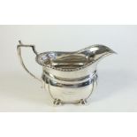A silver cream jug Birmingham 1939, marked Harrods, 140g