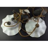 A pair of Edwardian opaque glass frilled light fittings on adjustable weighted cords