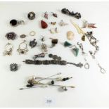 A selection of various costume jewellery to include a micro mosaic brooch, hat pins etc