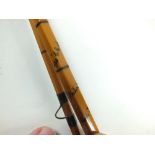 A Hardys Palakona two piece bamboo 'CC de France' split cane fishing rod. Missing eye loop at the