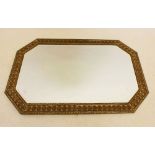 A brass framed mirror embossed shells, 78 x 50cm