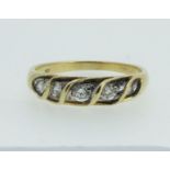 A 14 ct gold five stone diamond ring, size M