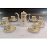 A Noritake floral printed coffee set comprising coffee pot, six cups and saucers, milk and sugar