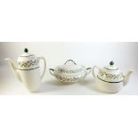 A Royal Doulton Almond Willow dinner service, comprising:-two tureens, coffee pot, teapot, two sauce