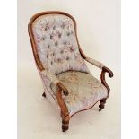 A Victorian mahogany armchair with scroll over arms