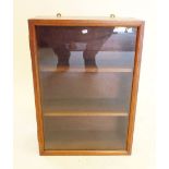 A small hanging display cabinet with glazed front