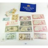 A wad of world banknotes with countries examples, Burma (Myanmar), China, India, Indonesia,