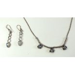 A silver moonstone necklace and matching earrings
