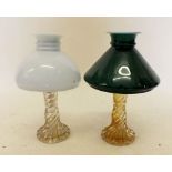 A pair of glass oil table lamps with shades