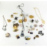 A selection of costume jewellery brooches etc.