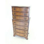 A 20th century walnut chest of seven drawers, 52cm wide