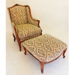 A fine French 20th century carved mahogany framed armchair with floral decoration and matching stool
