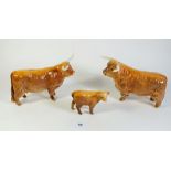 A Beswick Highland cow family, damaged horns