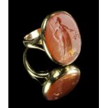 A 19th century gold ring with carved intaglio, 6.4g, size O