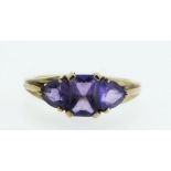 A 9ct gold set with three amethysts - size O.