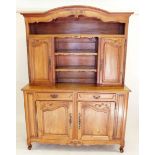 A French early 20th century satin walnut side cabinet with shelves over drawer and cupboards