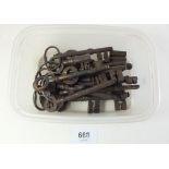 A box of various 19th century door keys