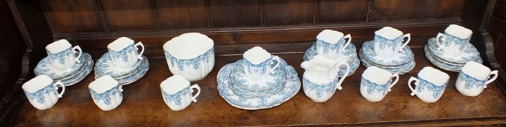 An Edwardian tea service with blue printed decoration comprising twelve cups and saucers (one cup - Image 3 of 3